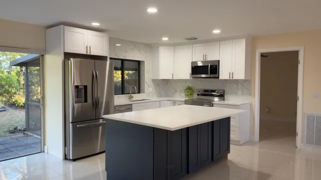 a kitchen with a refrigerator sink and microwave
