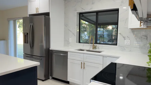 a kitchen with a sink and refrigerator