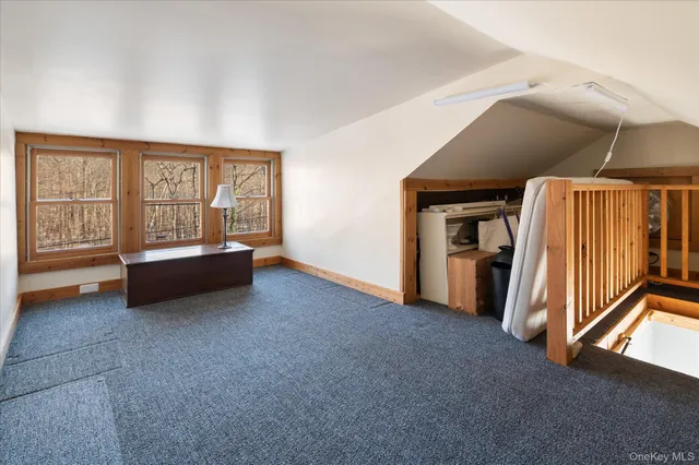 a view of an empty room with a fireplace