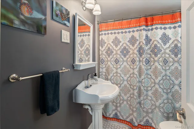 a view of backyard with barbeque grill and outdoor seating