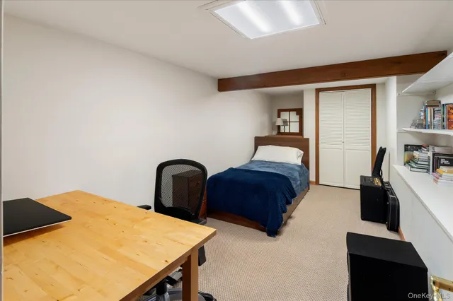 a bedroom with a bed and dresser