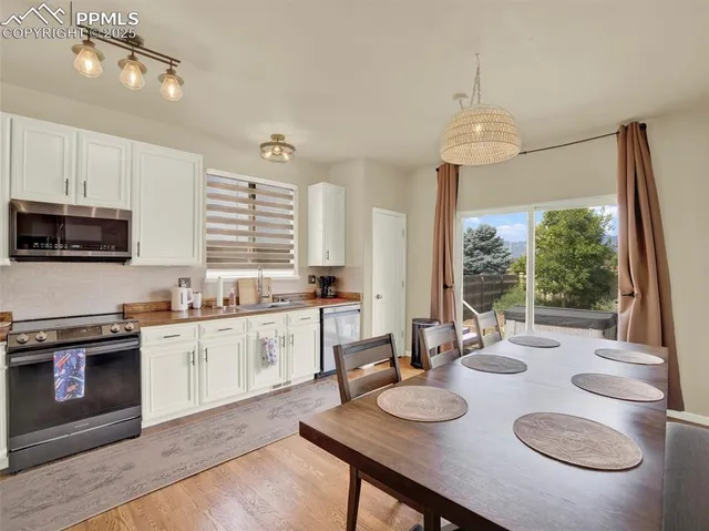 a kitchen with a sink cabinets and window