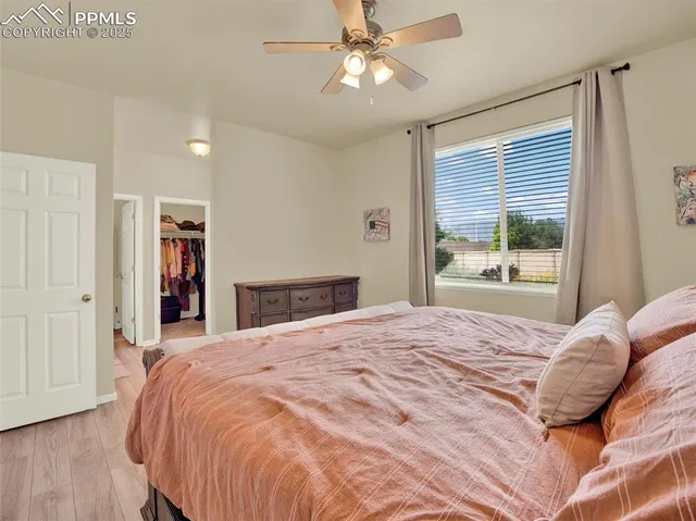 a bathroom with a sink a toilet and a large mirror