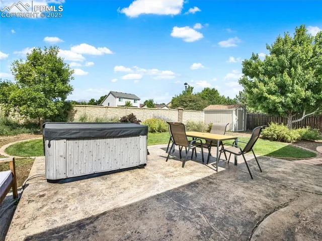 a view of a swimming pool with a yard