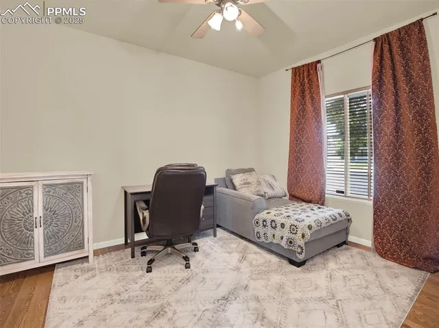 a bedroom with a bed chair and a window