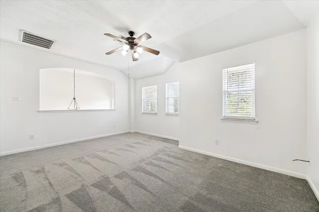 a view of an empty room with a window