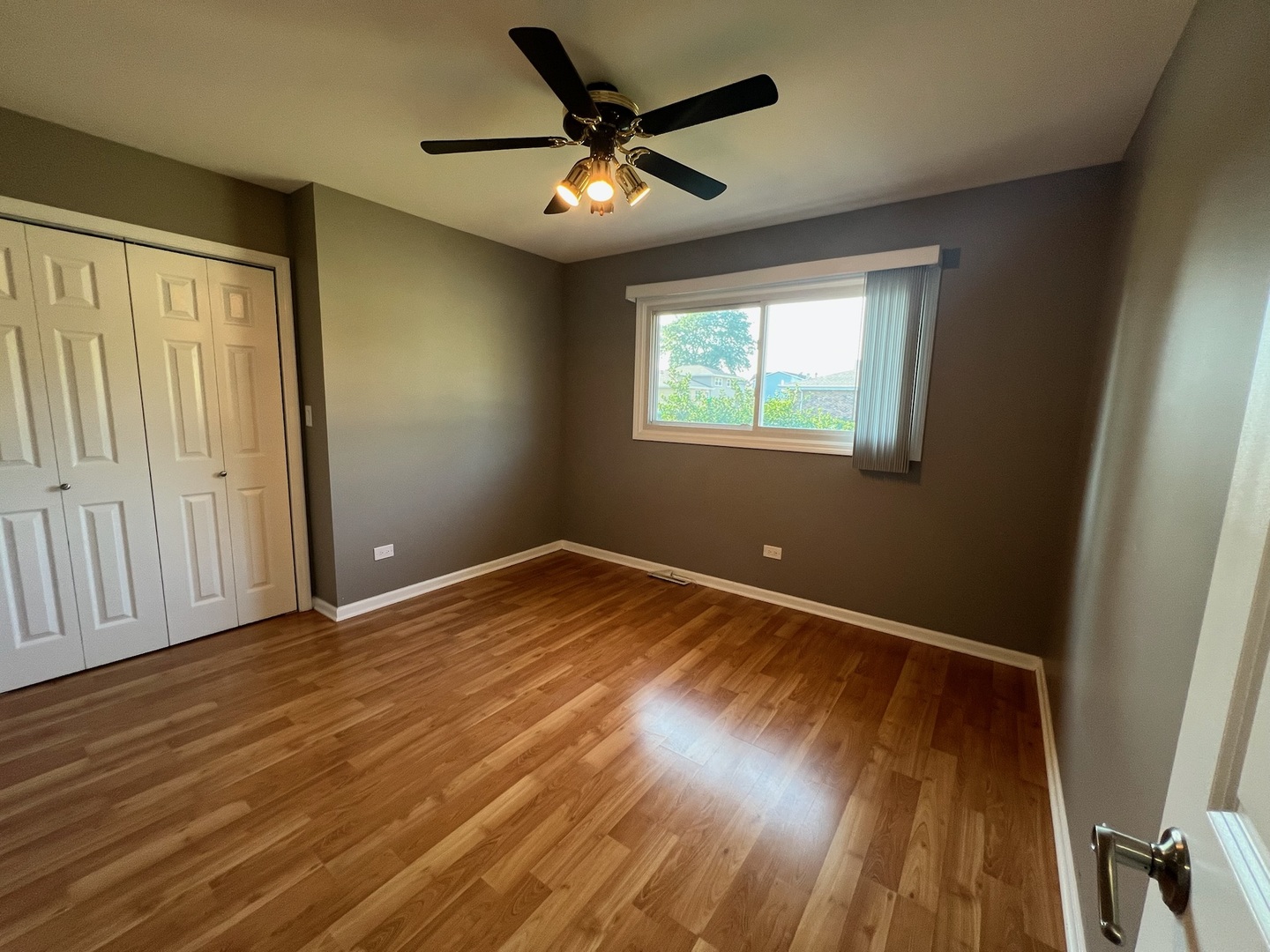 548 Delaware Trail Carol Stream, IL 60188 - Photo 15 of 26 wooden floor in an empty room with a window