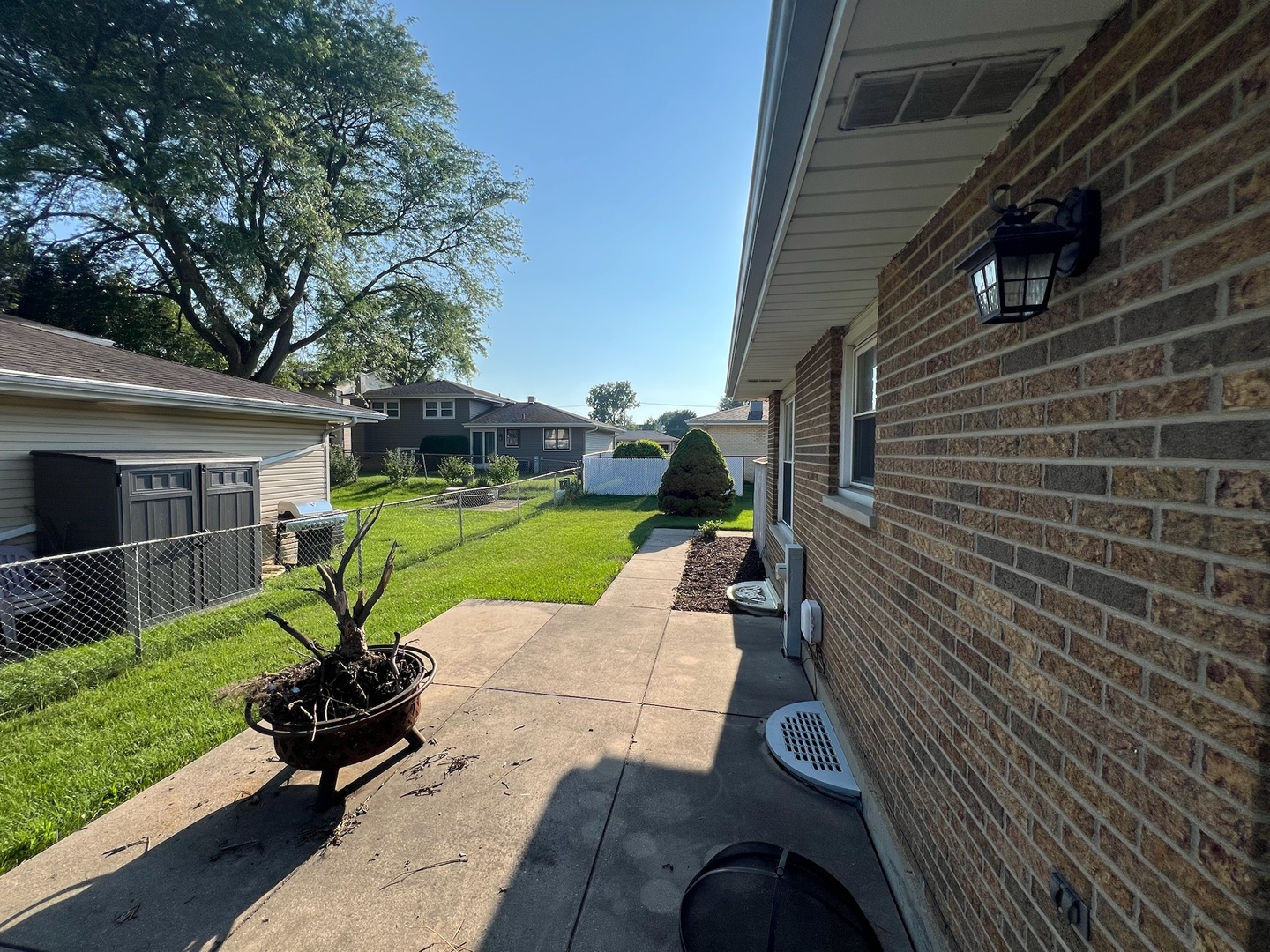 548 Delaware Trail Carol Stream, IL 60188 - Photo 25 of 26 a view of a house with backyard sitting area and garden