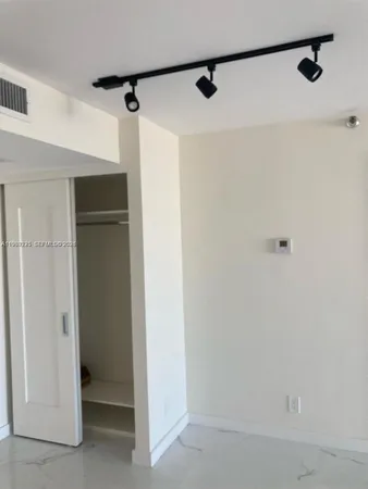 a bathroom with a sink vanity and a mirror