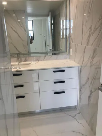 a white toilet sitting next to a bath tub and shower