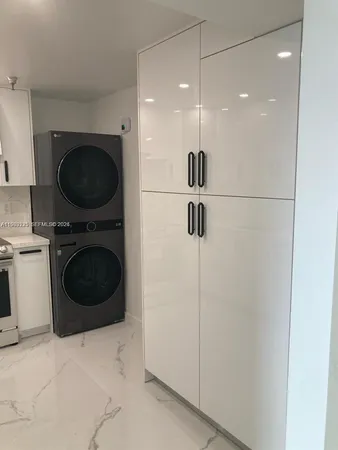 a bathroom with a toilet a sink and vanity
