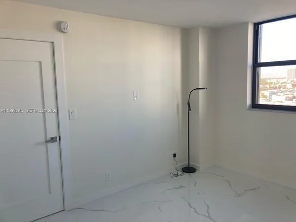 a view of a window in an empty room