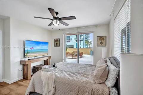 a bedroom with furniture and a window
