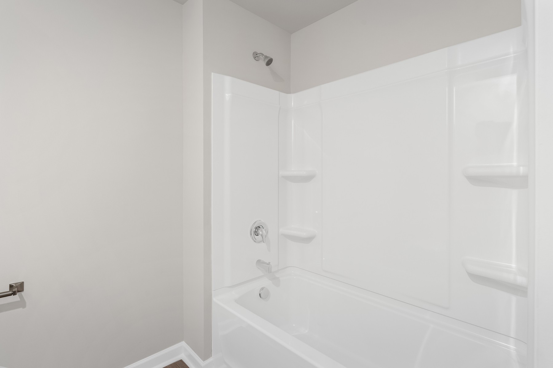 2038 Lala Loop White Bluff, TN 37187 - Photo 14 of 14 a white bath tub sitting next to a white wooden wall