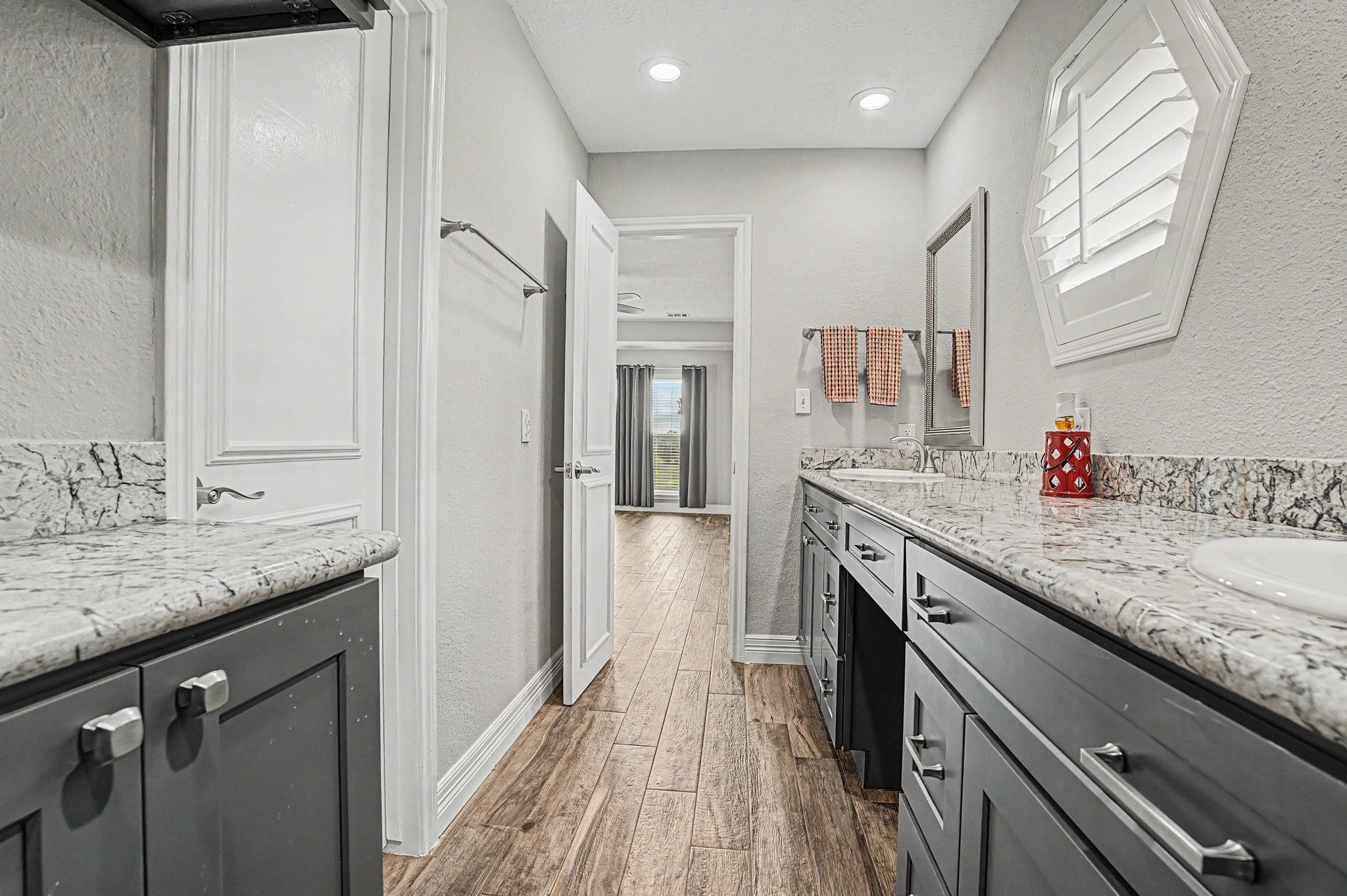 35564 Brumlow Road Hempstead, TX 77445 - Photo 17 of 46 a bathroom with a granite countertop sink a mirror and a shower