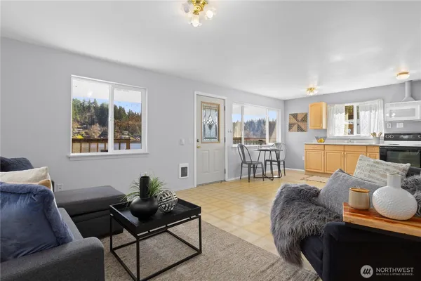 a living room with furniture and a table