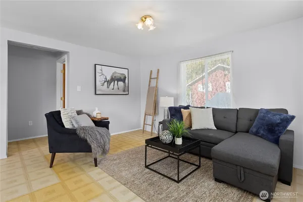 a living room with furniture and a window