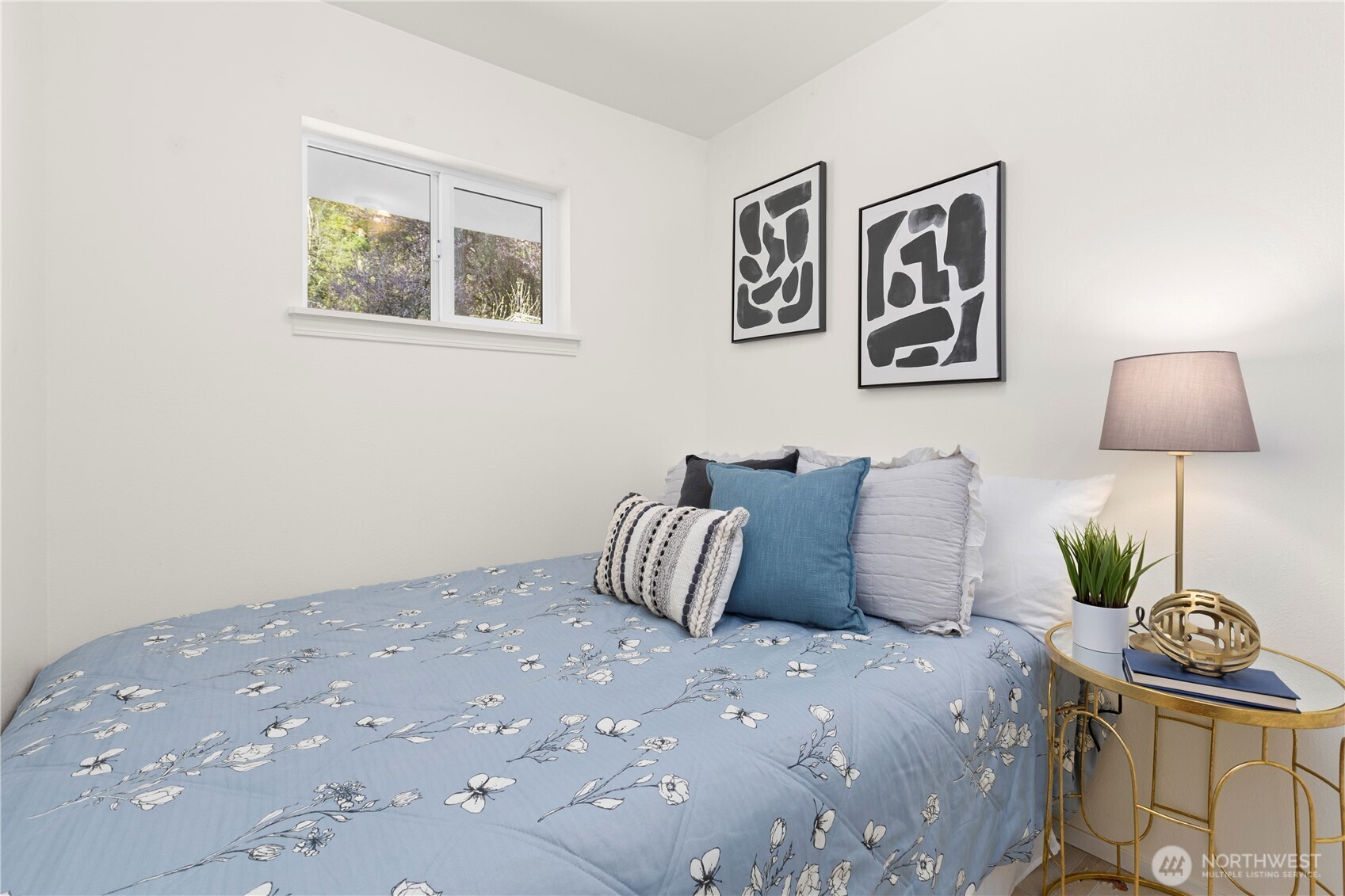 39201 Orville Road East Eatonville, WA 98328 - Photo 16 of 30 a bedroom with a bed and painting on the wall