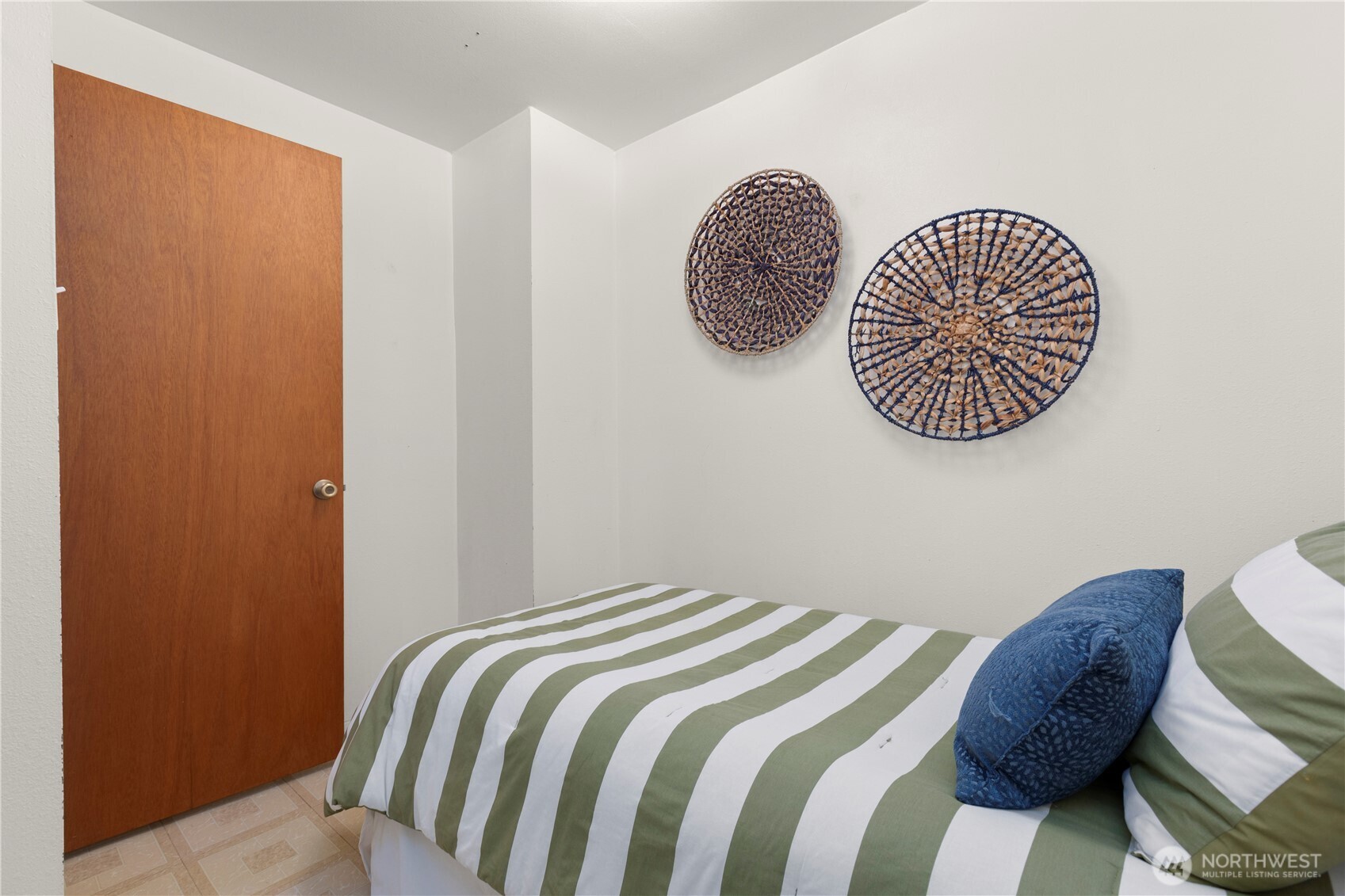 39201 Orville Road East Eatonville, WA 98328 - Photo 19 of 30 a bedroom with a bed and a chair