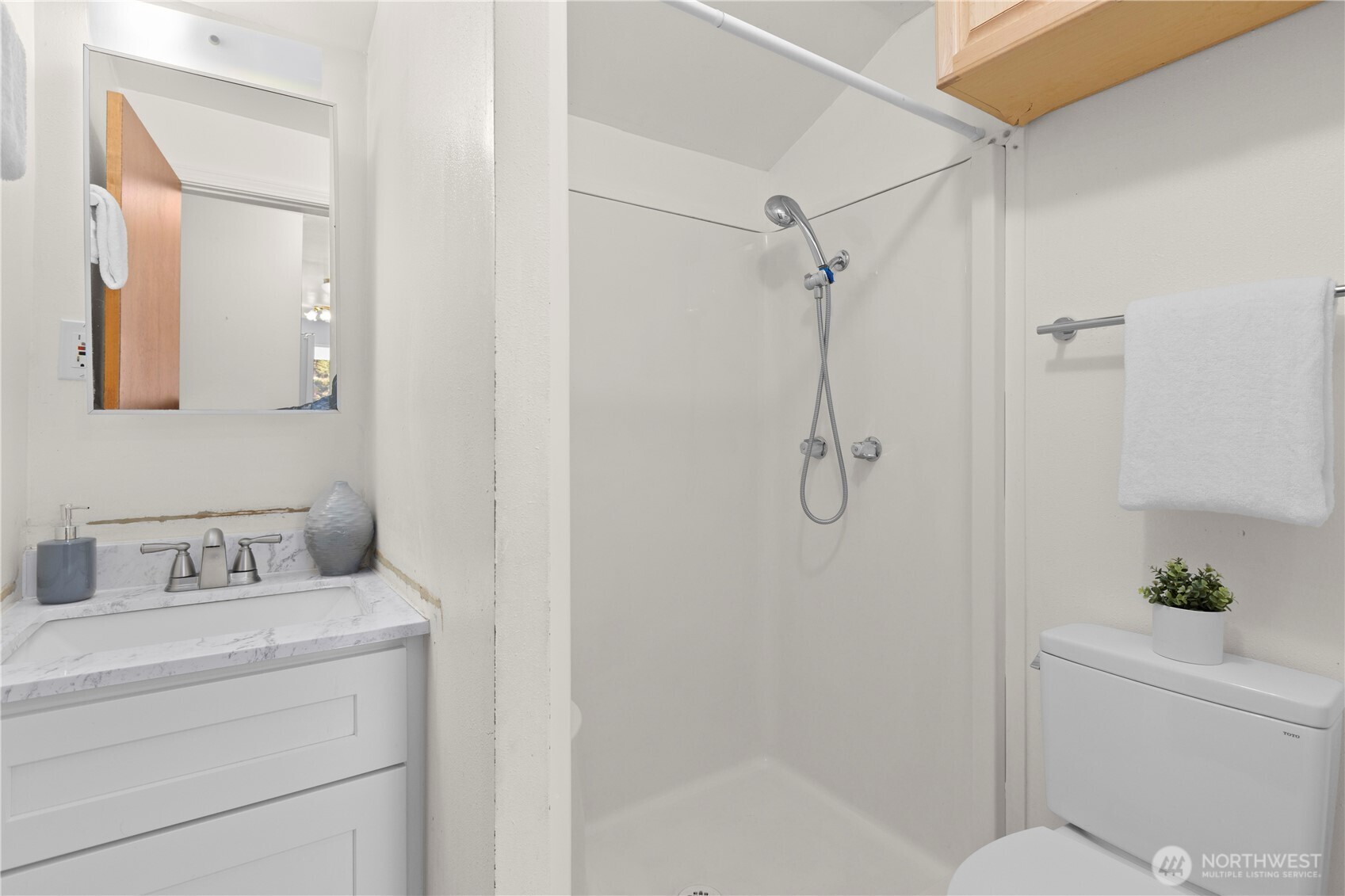 39201 Orville Road East Eatonville, WA 98328 - Photo 20 of 30 a bathroom with a shower sink vanity and toilet