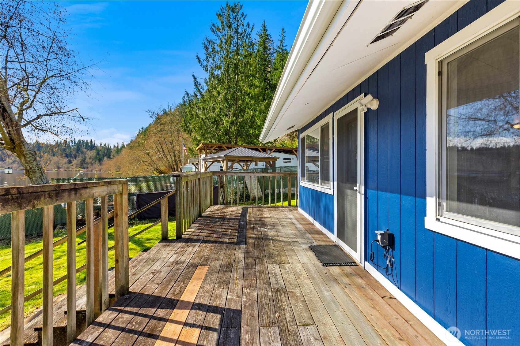 39201 Orville Road East Eatonville, WA 98328 - Photo 22 of 30 a view of balcony with wooden floor and outdoor seating