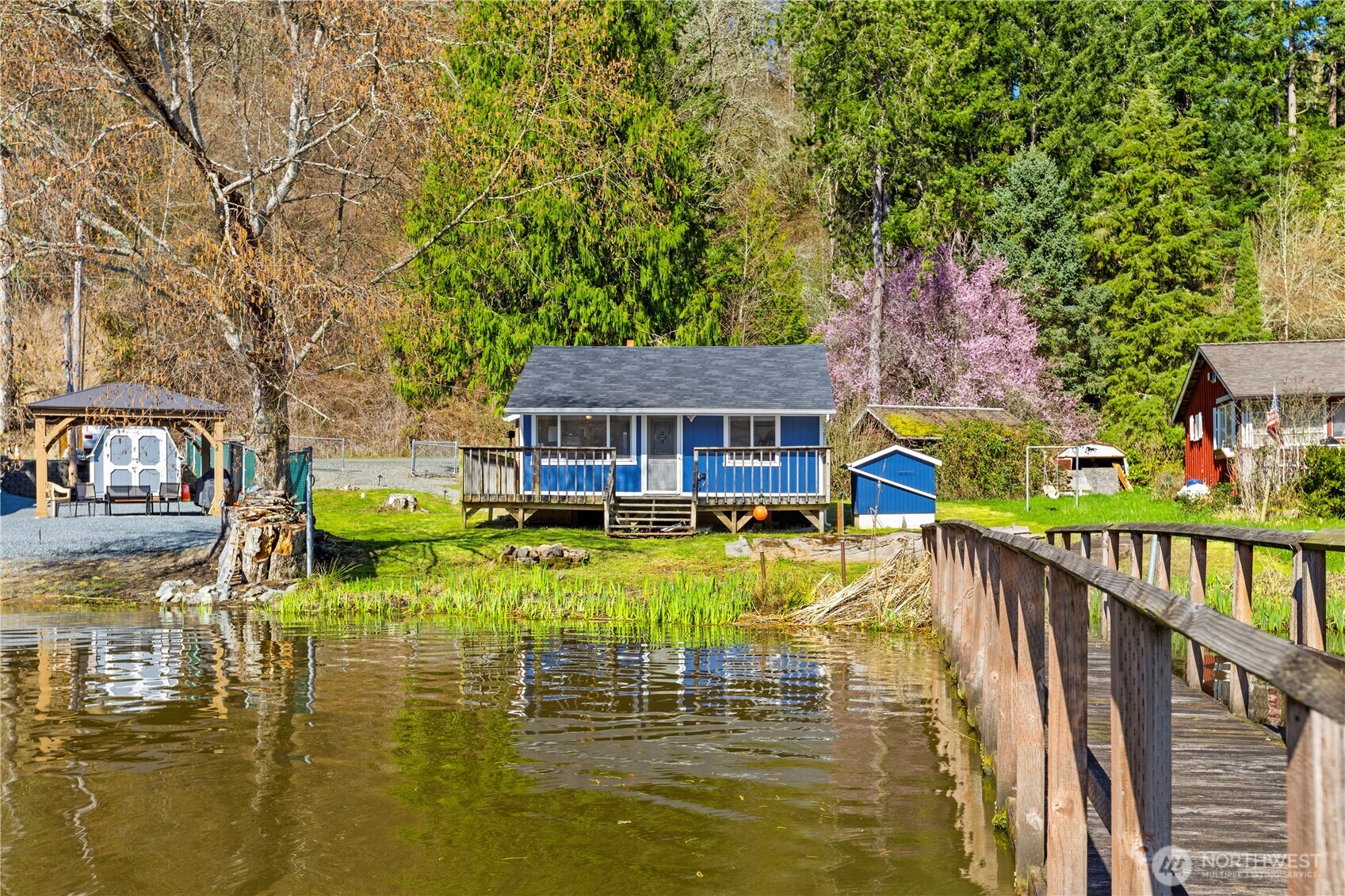39201 Orville Road East Eatonville, WA 98328 - Photo 26 of 30 a swimming pool with outdoor seating and yard