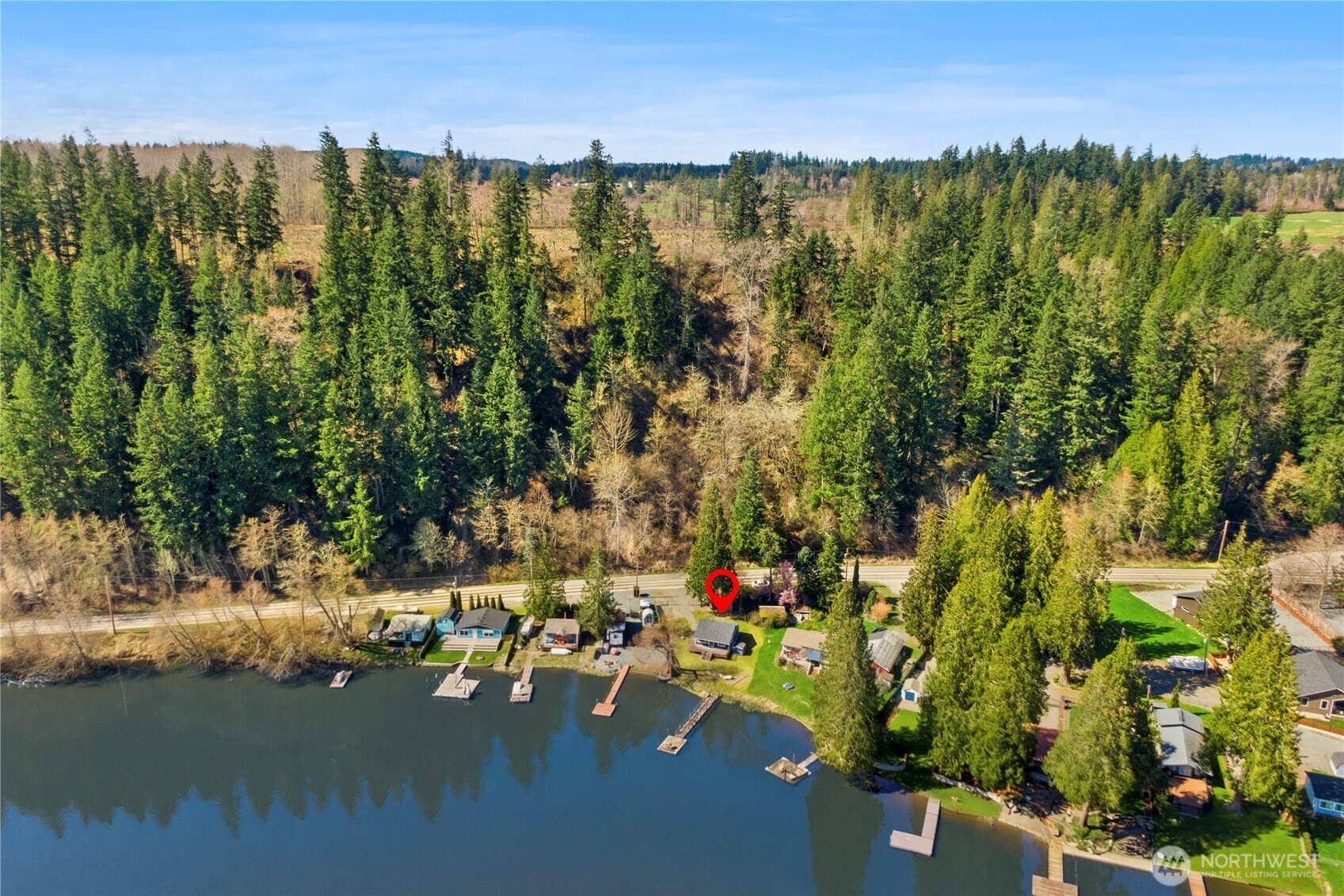 39201 Orville Road East Eatonville, WA 98328 - Photo 28 of 30 a view of a lake with a house in the background