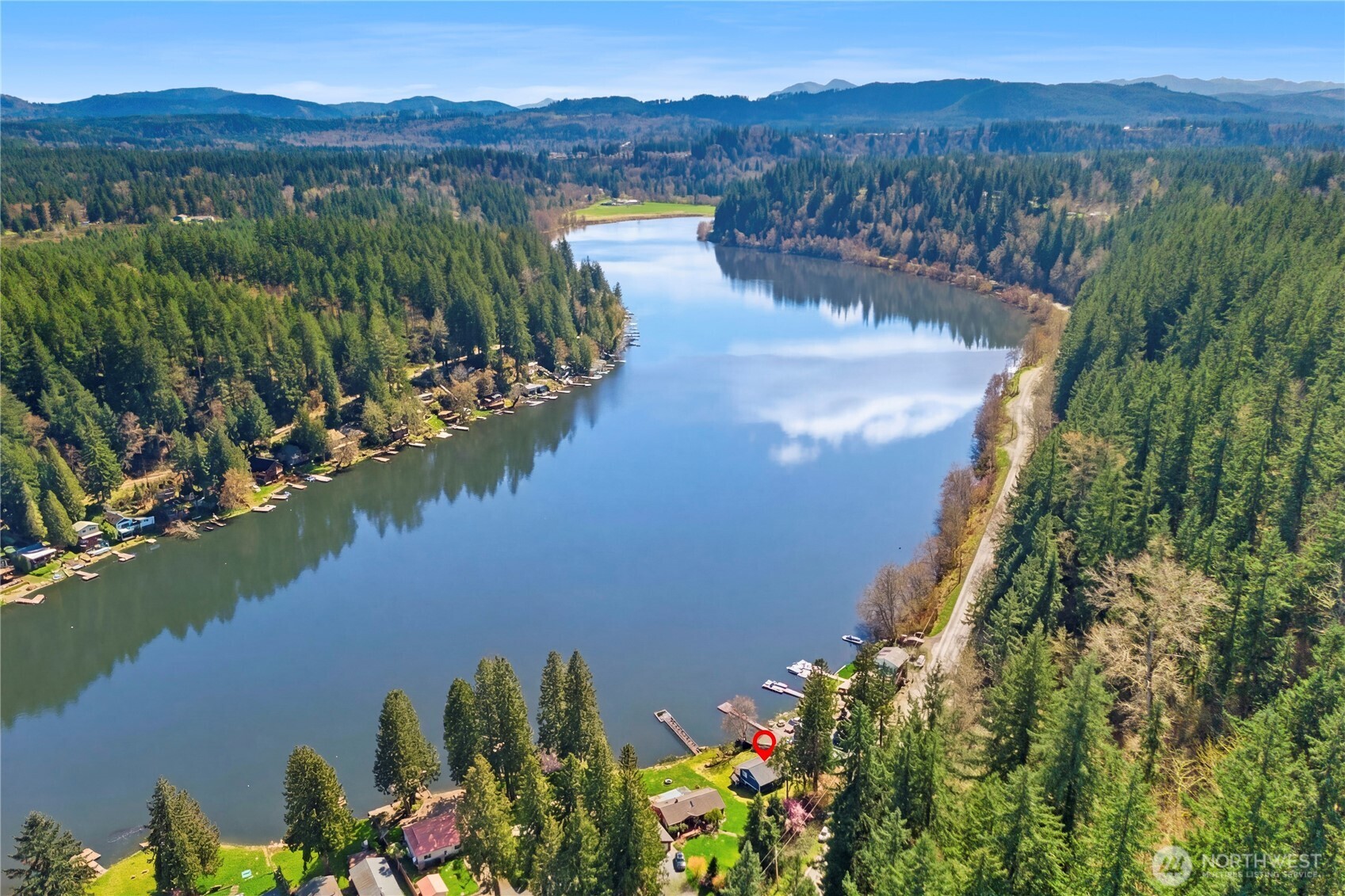 39201 Orville Road East Eatonville, WA 98328 - Photo 29 of 30 a view of a lake with a mountain in the background