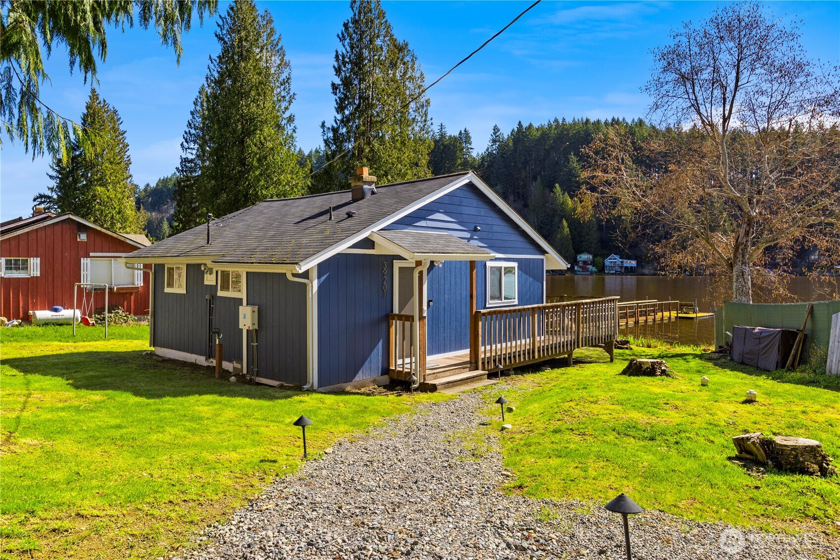 39201 Orville Road East Eatonville, WA 98328 - Photo 5 of 30 a front view of house with yard and trees in the background
