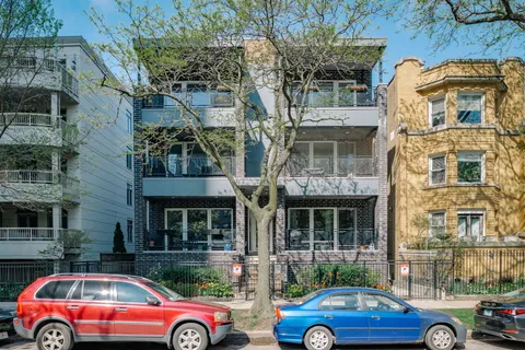 a front view of a house with parking space