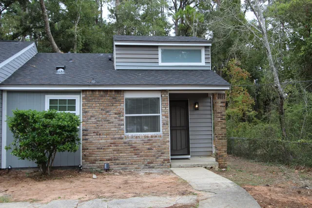 a view of a house with a garden