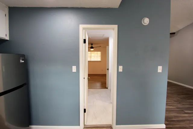 a view of a bathroom from a hallway