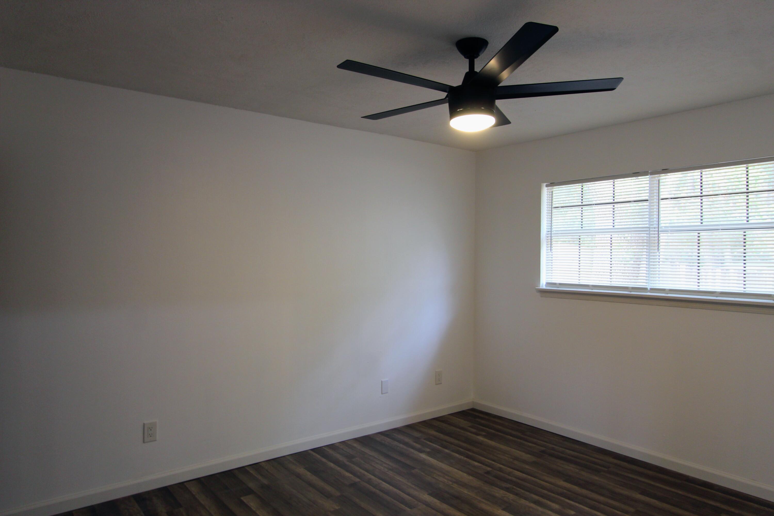 8250 Kause Road Pensacola, FL 32506 - Photo 14 of 28 an empty room with a window and a fan