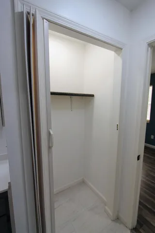a bathroom with a glass shower door
