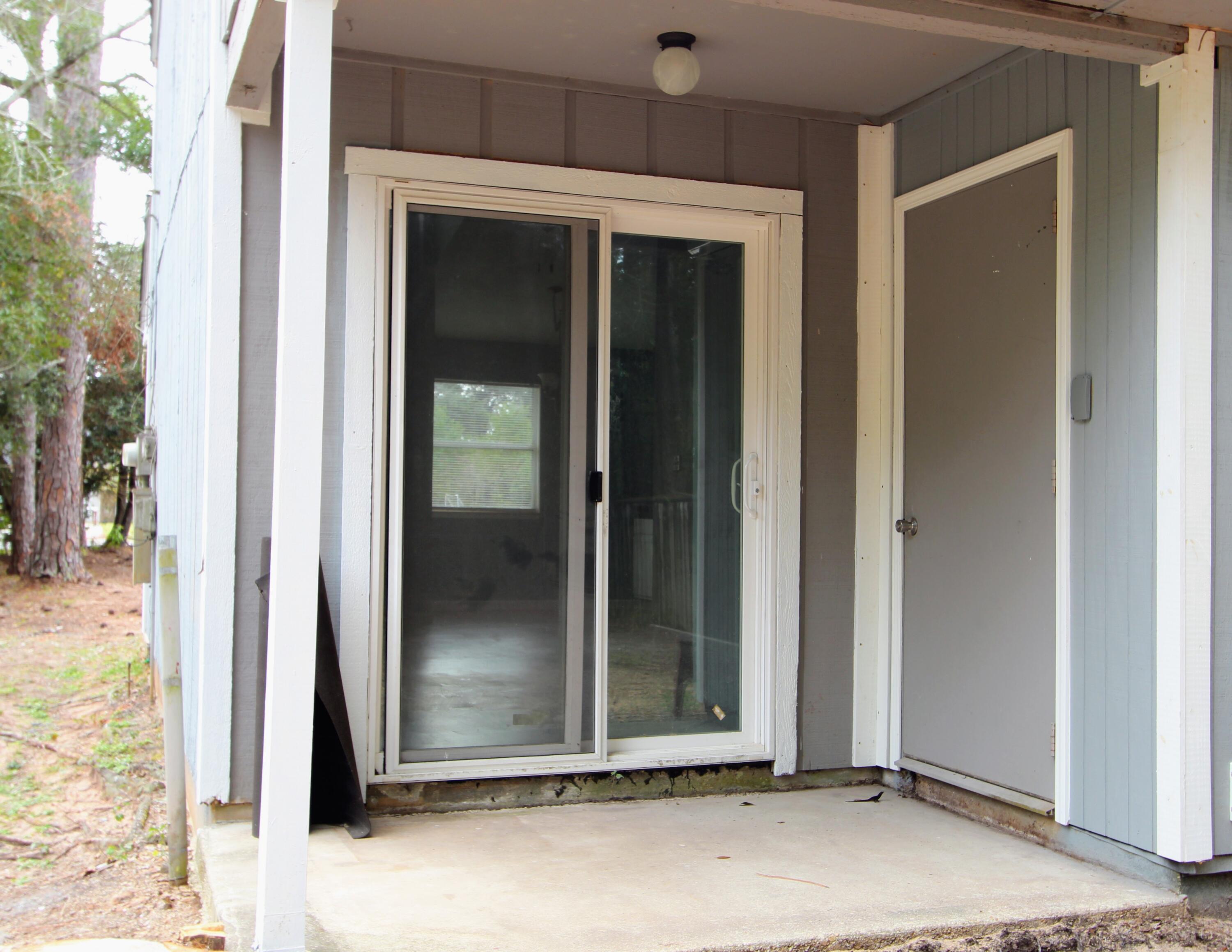 8250 Kause Road Pensacola, FL 32506 - Photo 20 of 28 a view of a room that has a door