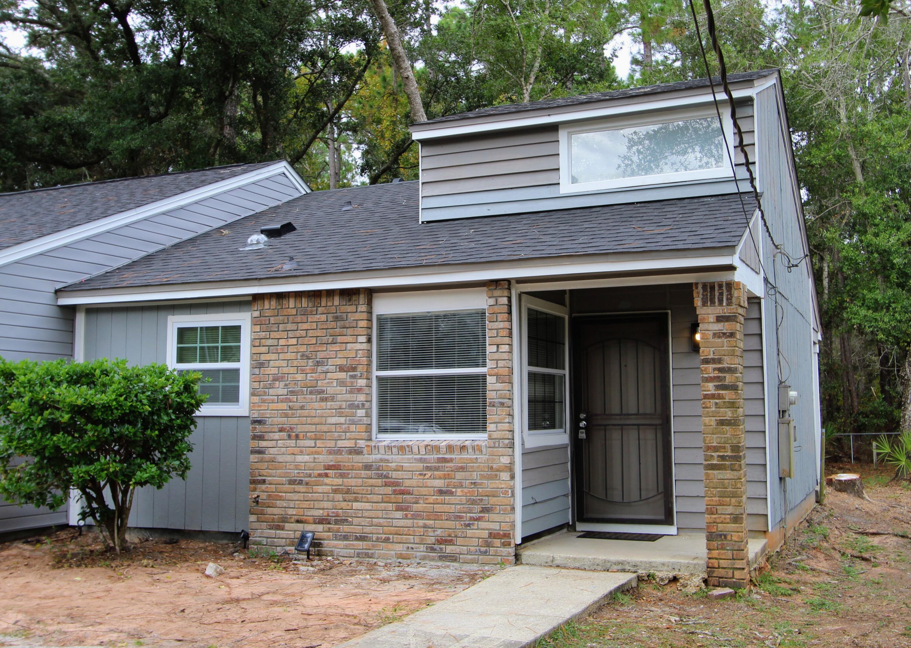 8250 Kause Road Pensacola, FL 32506 - Photo 27 of 28 a front view of a house with garden