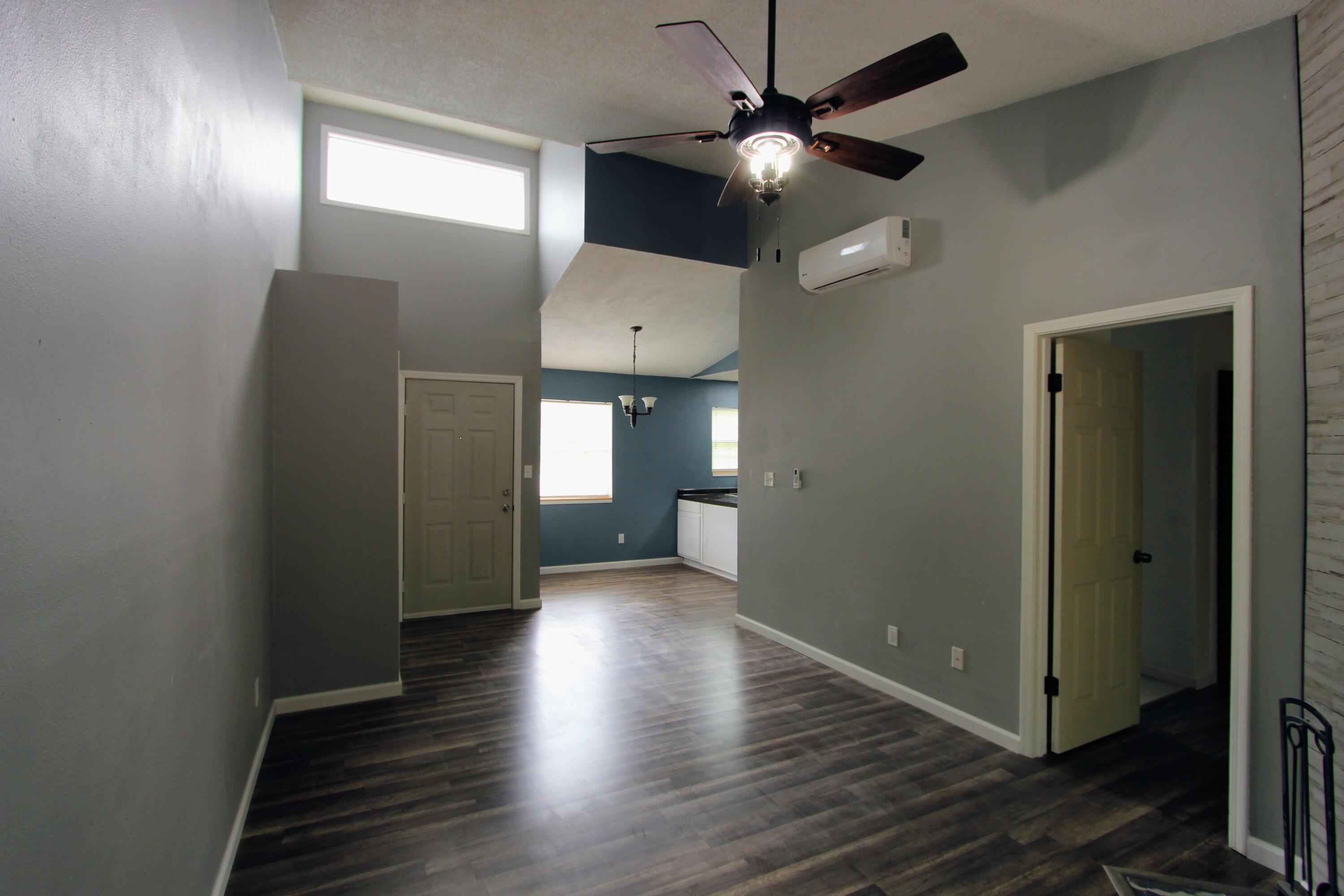 8250 Kause Road Pensacola, FL 32506 - Photo 4 of 28 wooden floor in an empty room with a window