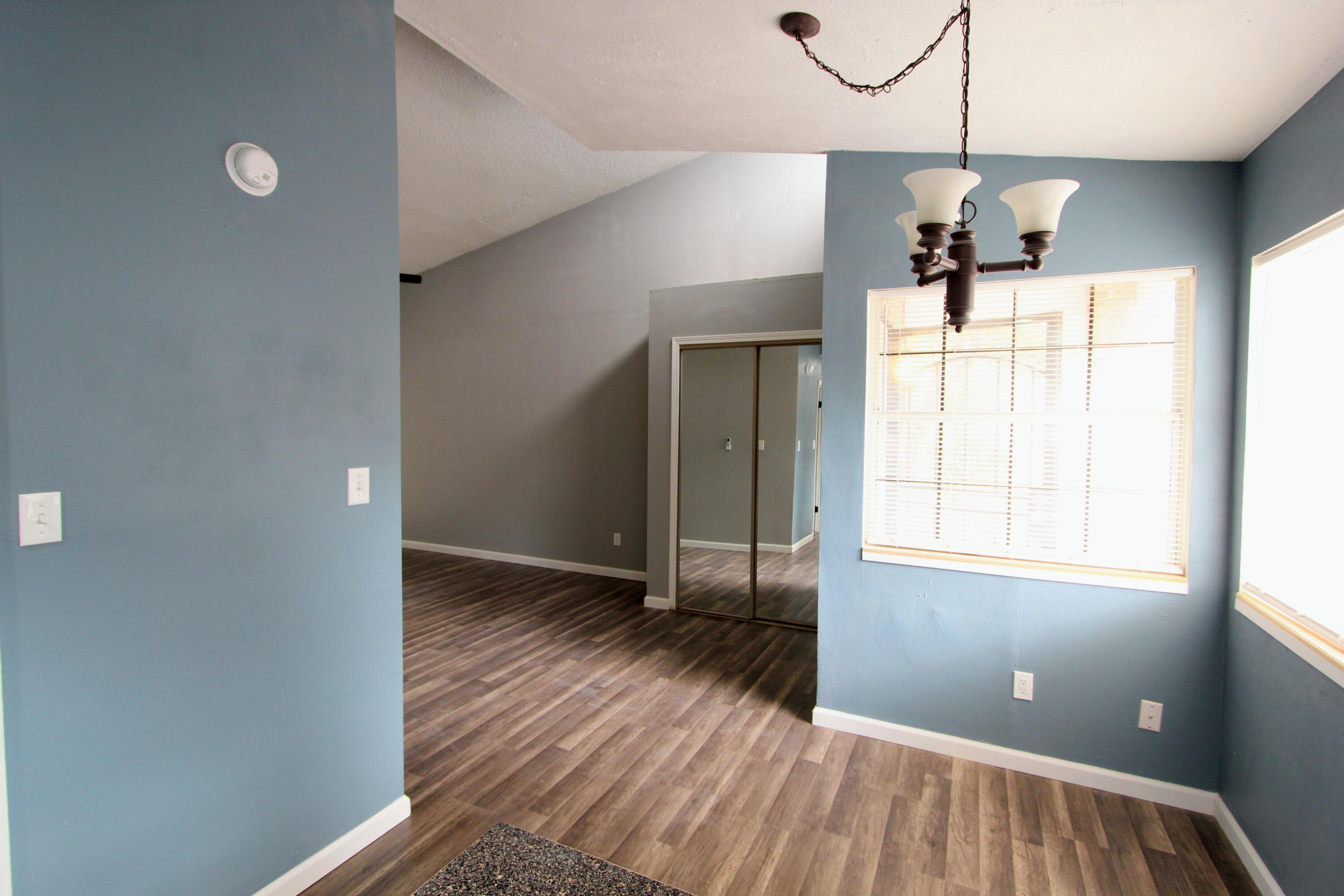 8250 Kause Road Pensacola, FL 32506 - Photo 7 of 28 a view of empty room with wooden floor and fan