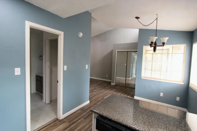 a view of a kitchen cabinets and wooden floor