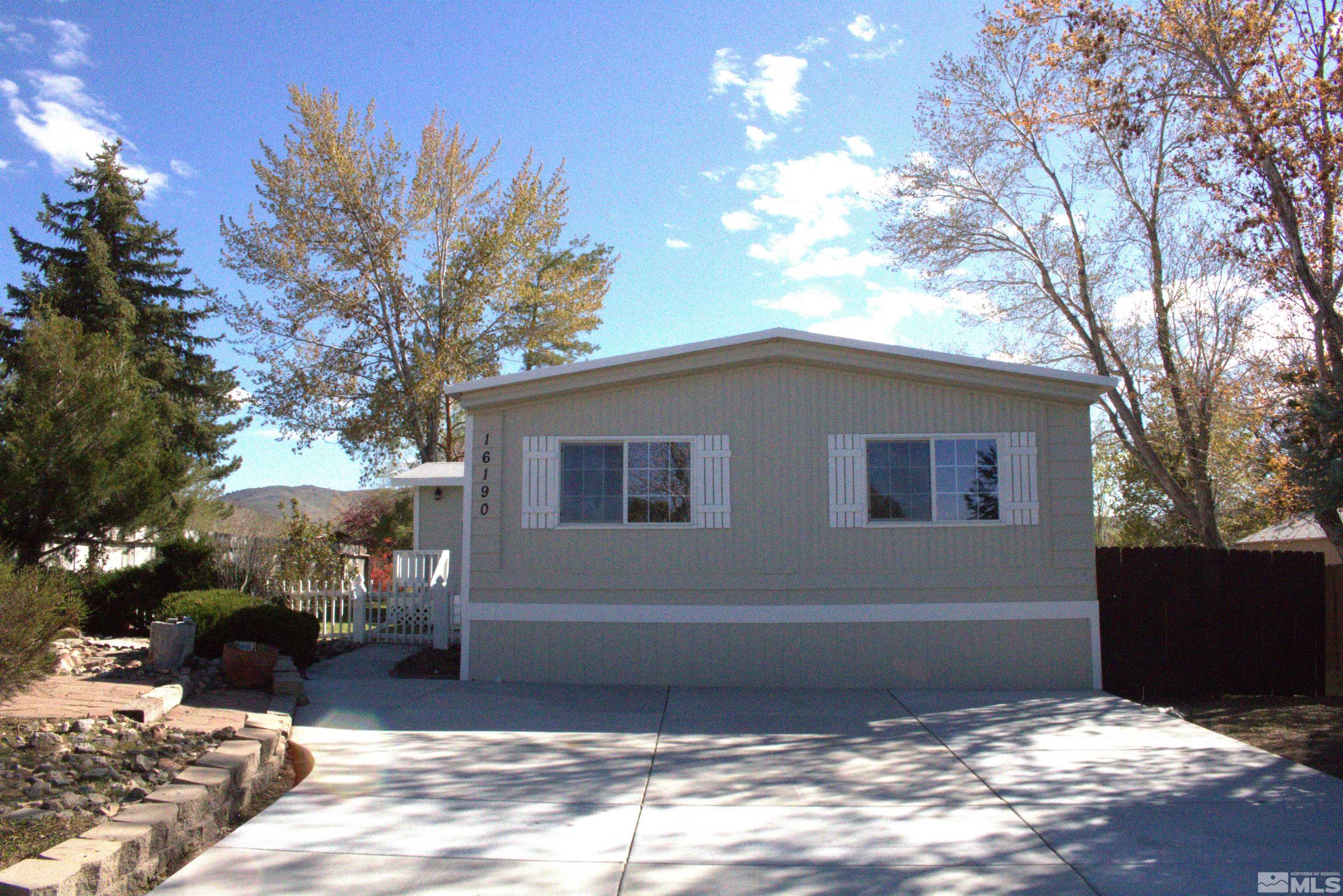 16190 Rhyolite Circle Reno, NV 89521 - Photo 1 of 28 a backyard of a house with table and chairs