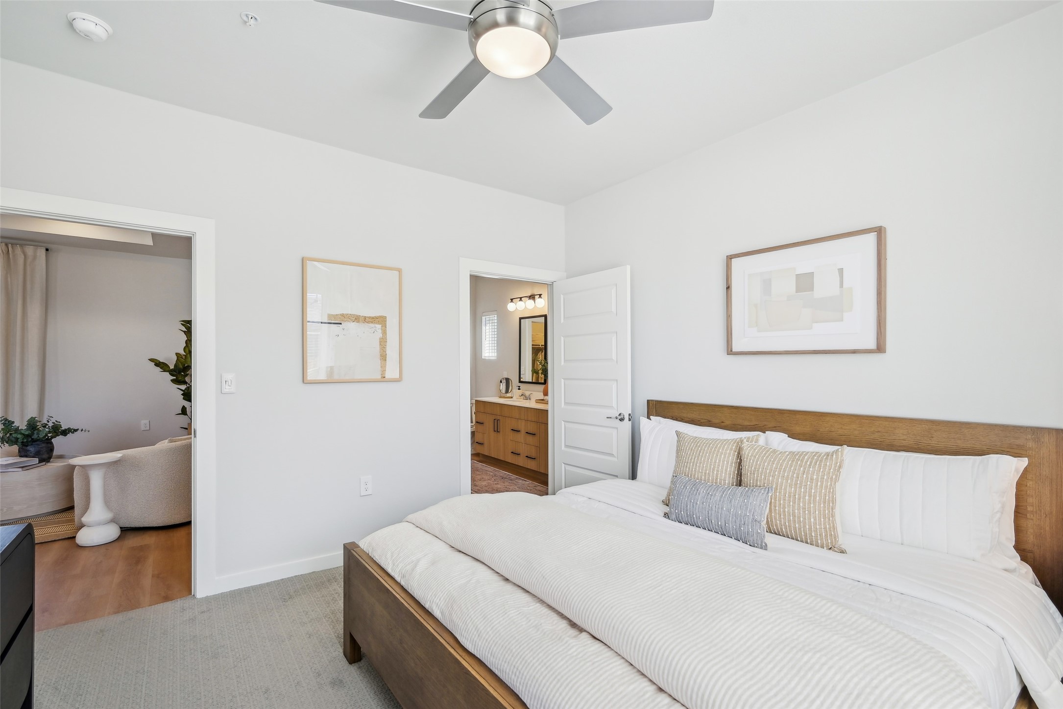 3651-313 South Custer Road McKinney, TX 75070 - Photo 20 of 28 a bedroom with a large bed and a chandelier