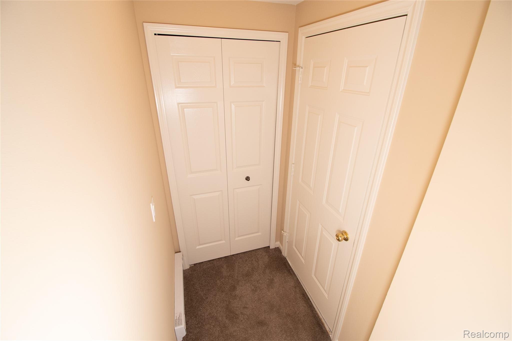 3580 Tremonte Circle, Unit 277 Rochester, MI 48306 - Photo 36 of 48 Door to Garage Closet.jpg