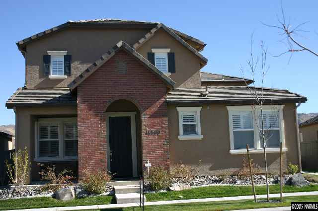 10580 Twin Bridges Way Reno, NV 89521 - Photo 1 of 9 a front view of a house with a yard