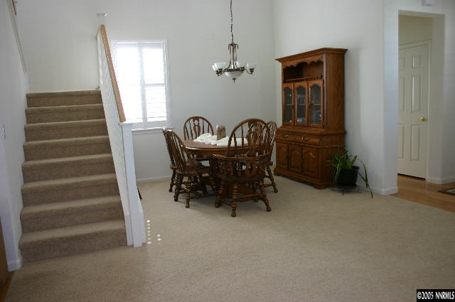 10580 Twin Bridges Way Reno, NV 89521 - Photo 6 of 9 a view of a room with entryway wooden floor and windows