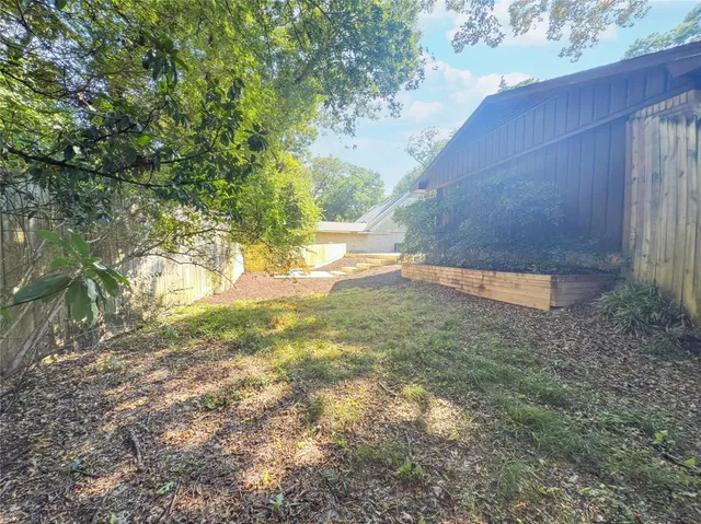 a backyard of a house with lots of green space