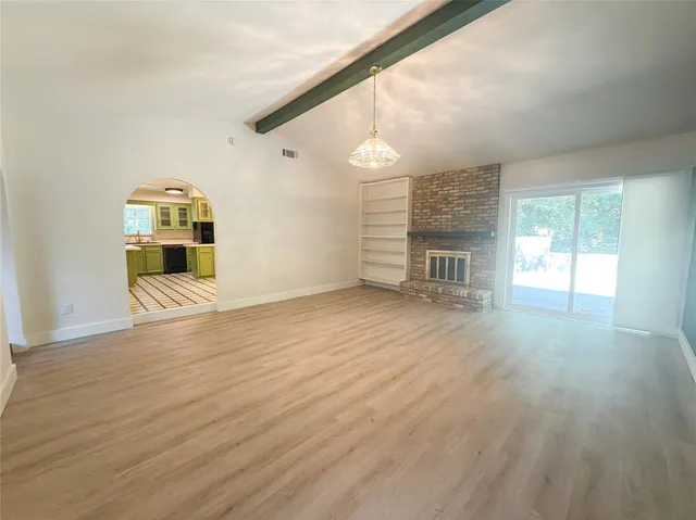 a view of a livingroom with wooden floor