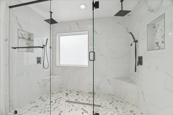 a bathroom with a shower and a shower