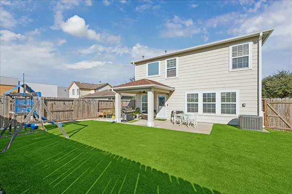 a front view of house with yard patio and green space