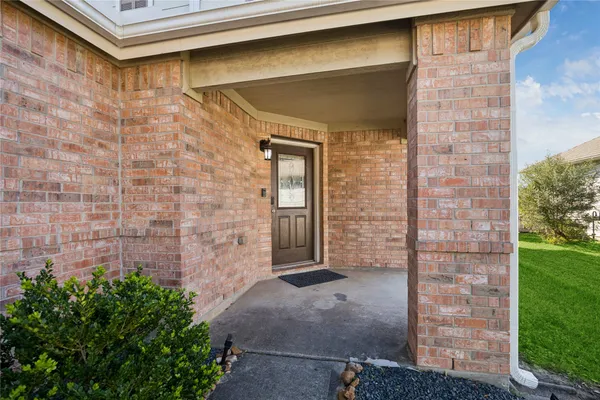 a view of a brick house with a large door