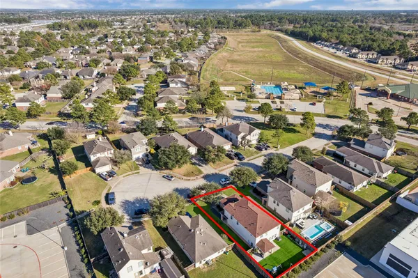 an aerial view of residential houses with outdoor space